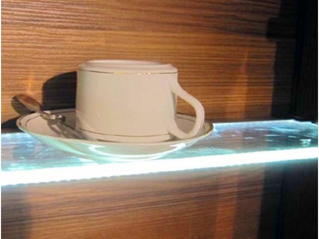An illuminated glass shelf